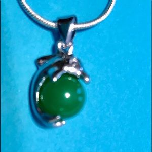 24” .925 necklace with a dolphin and green ball